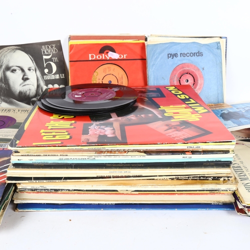 210 - A quantity of vinyl, LPs and 45s, including Frank Zappa, UB40, Wham, The Beatles etc