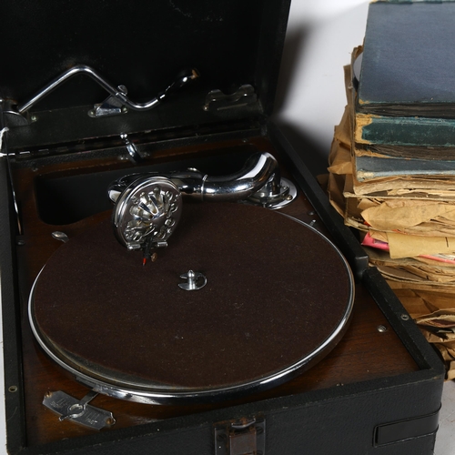 225 - An HMV portable gramophone, in black carry case, complete with pick-up and winding handle, and a box... 