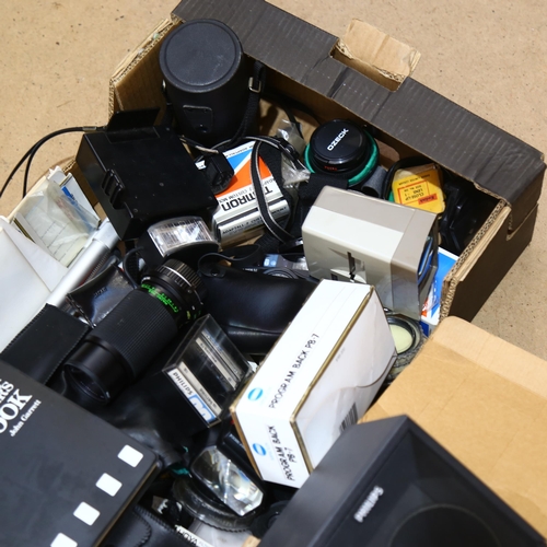 232 - A quantity of various Vintage camera equipment and accessories, various lenses, film and speakers in... 