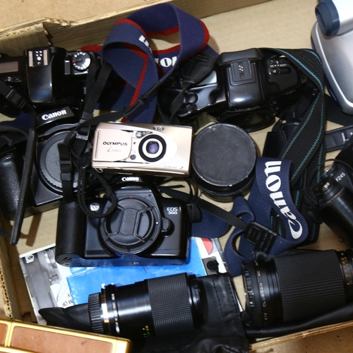 233 - A quantity of various Vintage cameras and accessories, including Canon, Minolta, Polaroid etc