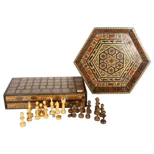 277 - An Iranian chess set, with bone and wood inlaid decoration, in protective case, and a tray of simila... 