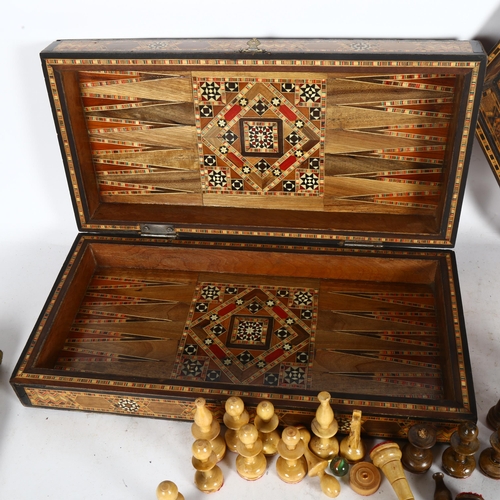 277 - An Iranian chess set, with bone and wood inlaid decoration, in protective case, and a tray of simila... 