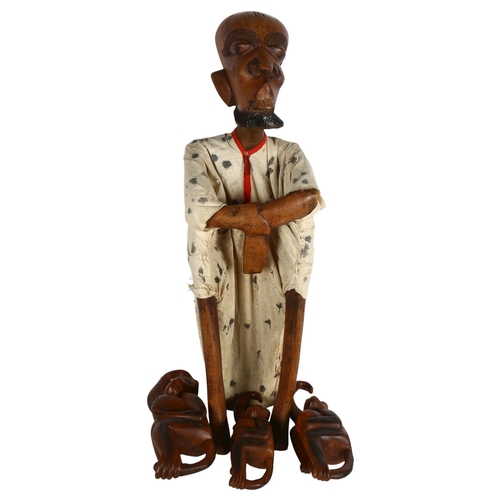 288 - A wooden carved African figure, and a group of hanging monkeys, largest height 73cm