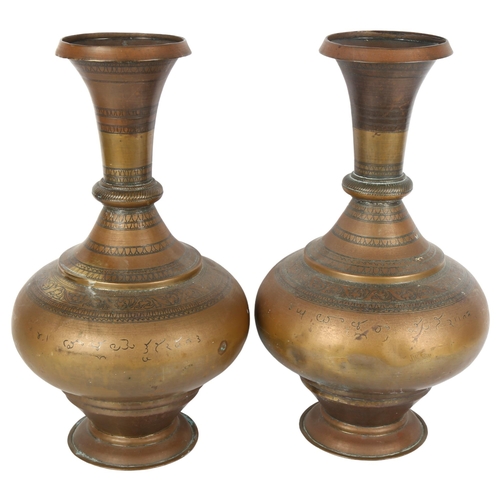 309 - A pair of Antique Persian copper vases, height 38cm