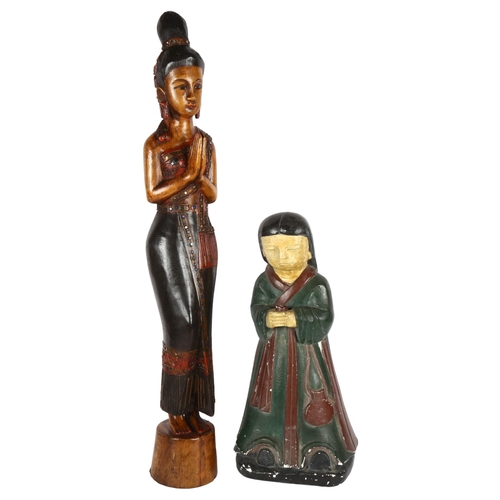 311 - A carved wood Thai deity figure, and a plaster carved kneeling religious figure, largest height 78cm... 