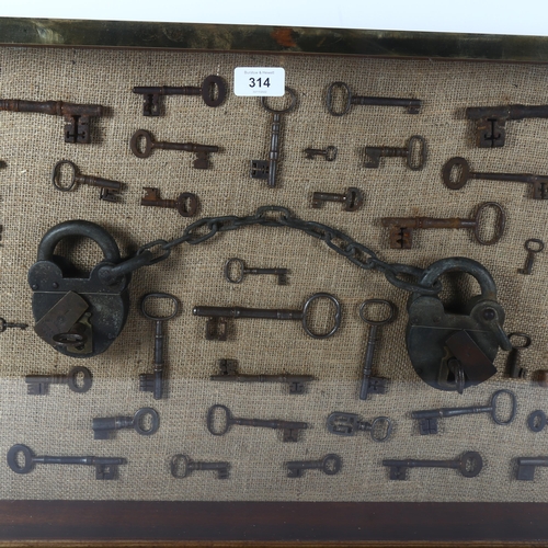 314 - A large wall-hanging display case containing Vintage and Antique skeleton keys, including a set of V... 