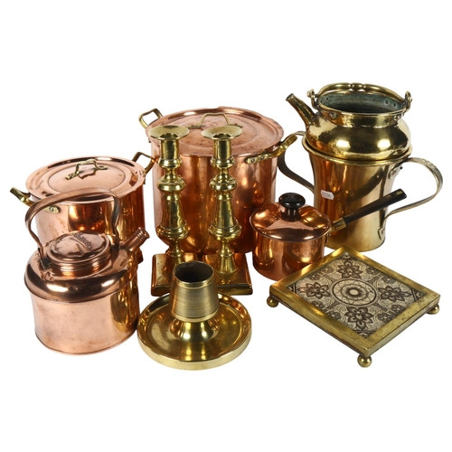 317 - A quantity of brass and copper kitchen utensils, including various boiling pots, teapots, a teapot s... 