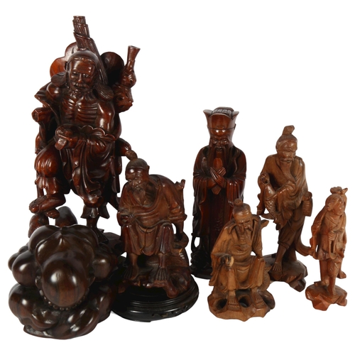 318 - A quantity of Oriental figurines, depicting various fishermen and sages, largest height 38cm (7)