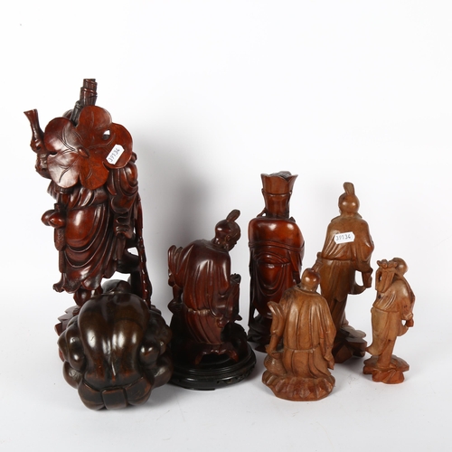 318 - A quantity of Oriental figurines, depicting various fishermen and sages, largest height 38cm (7)