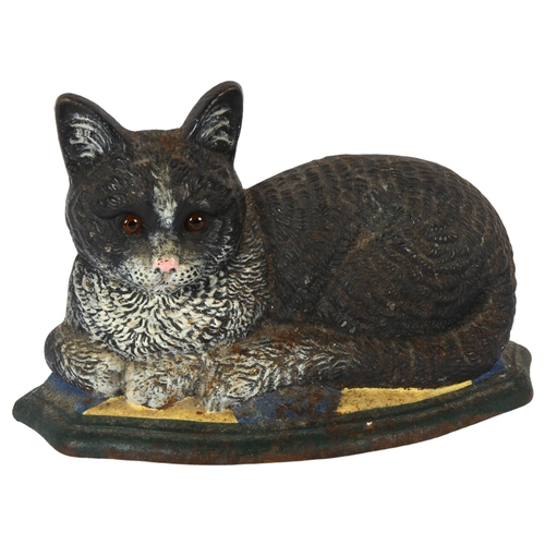 324 - A cast-iron door stop in the shape of a cat, length 30cm, height 20cm