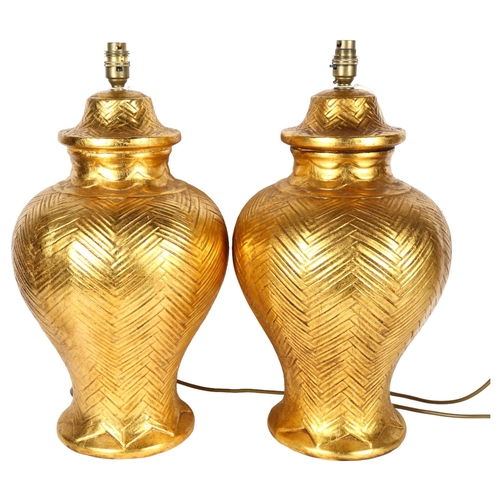 336 - A pair of large modern gilded ceramic table lamps, height 50cm