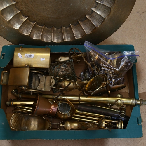 340 - An Anglo-Indian brass engraved serving tray, several brass syringes or garden rose sprayers, various... 