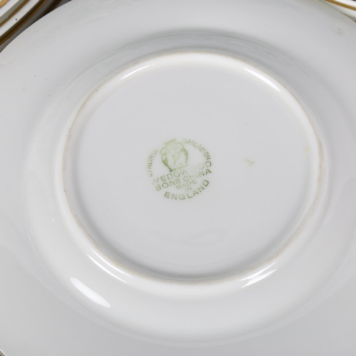 413 - Wedgwood bone china dinner, dessert and side plates, with floral decoration and matching sauceboat