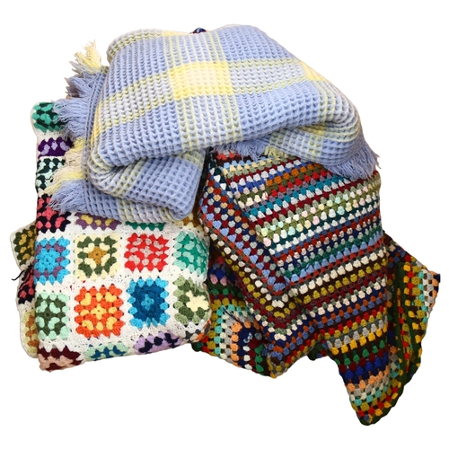 427 - A waffle throw, a crochet wool bedspread and a patchwork crochet throw, 215cm x 150cm