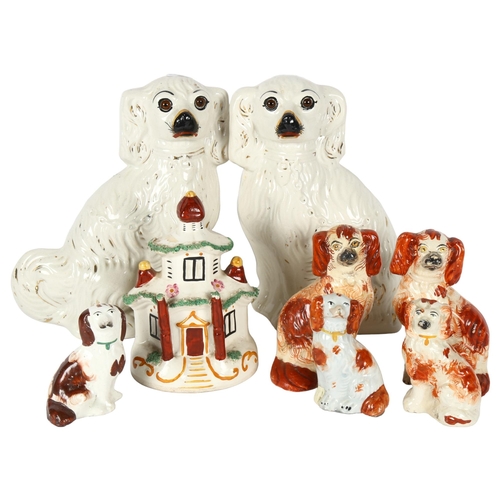 433 - A pair of white Staffordshire Spaniels, height 25cm, a smaller pair, cottage money box etc