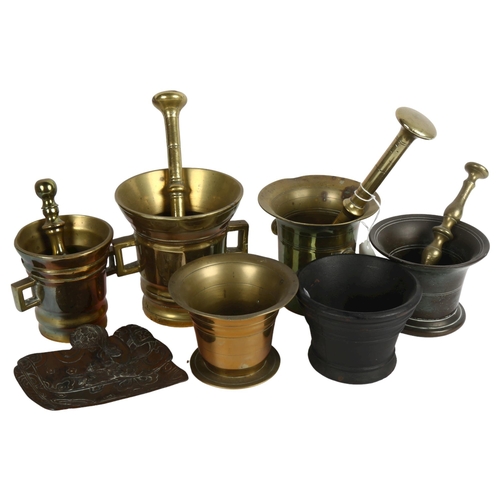 455 - A group of brass and iron pestles and mortars, and a copper dish