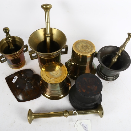 455 - A group of brass and iron pestles and mortars, and a copper dish