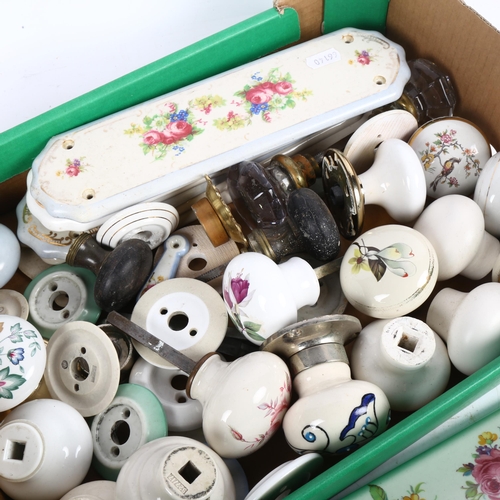 459 - A box of ceramic and other door knobs, and various ceramic finger plates