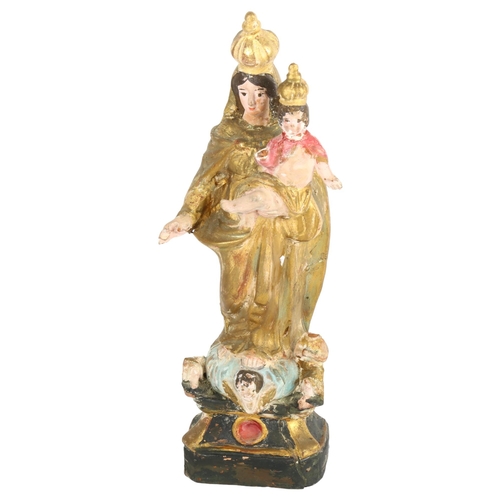 461 - An Antique painted and gilded terracotta Madonna and Child, 30cm