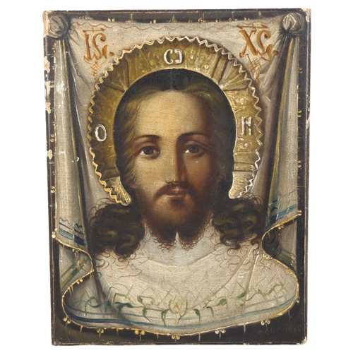 462 - A printed and painted icon on wooden panel, height 22cm