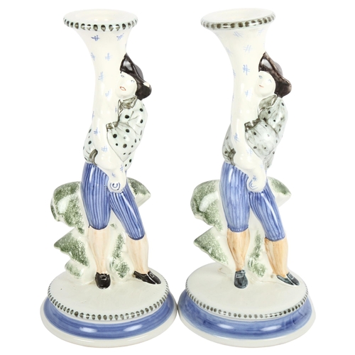 465 - A pair of Rye Pottery candlesticks with figure supports, 26.5cm