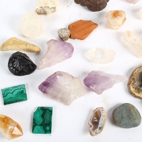 488 - A collection of polished stones and minerals, including amethyst