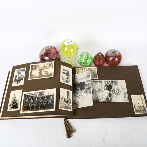 495 - A Vintage family photograph album, and 5 glass paperweights