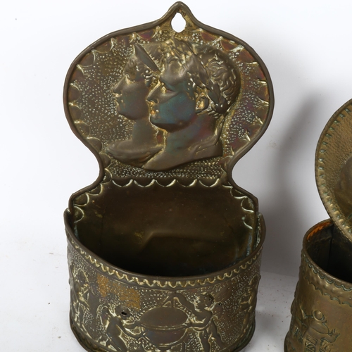 507 - A pair of continental  wall-mounted embossed brass candle boxes, tallest 25cm