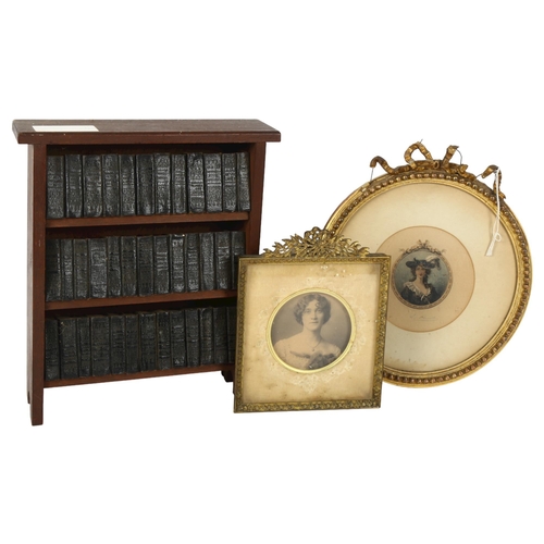 512 - A book case containing an Antique set of miniature Shakespeare, book height 5cm, and 2 portrait mini... 