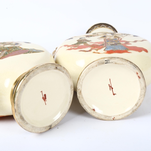 530 - A pair of Japanese cream ground moon flasks, with gilded dragon handles, height 32cm