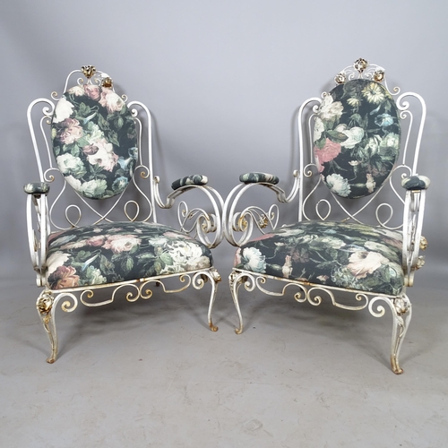 2653 - A pair of mid-century French wrought-iron conservatory lounge chairs, with scrolled arms, in the man... 