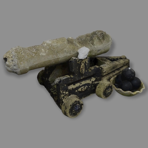 2683 - A weathered concrete garden cannon ornament, with balls, 125 x 50 x 50cm