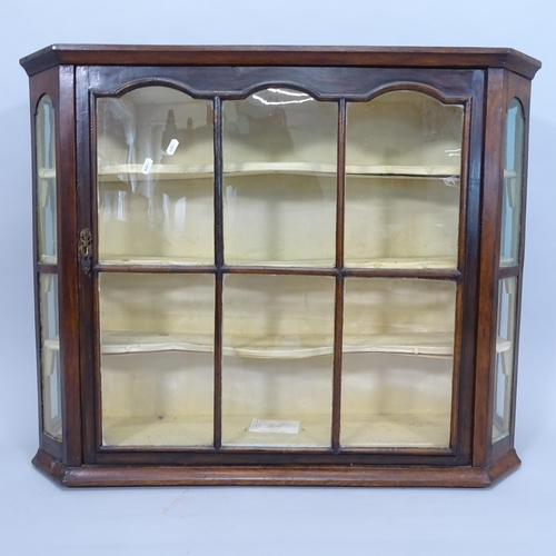 2693 - An Antique mahogany hanging display cabinet of canted form, 89cm x 73cm x 22cm, a stool, a brass fen... 