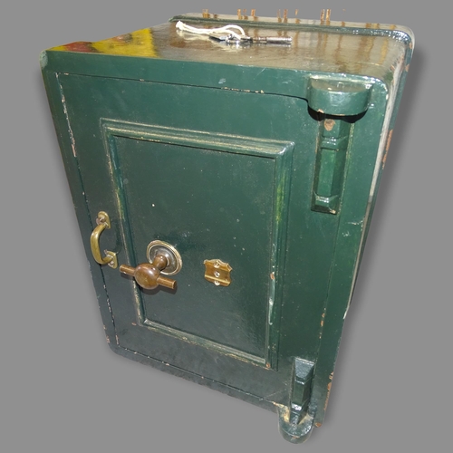 2696 - A painted metal floor safe, 46 x 62 x 45cm (with key)