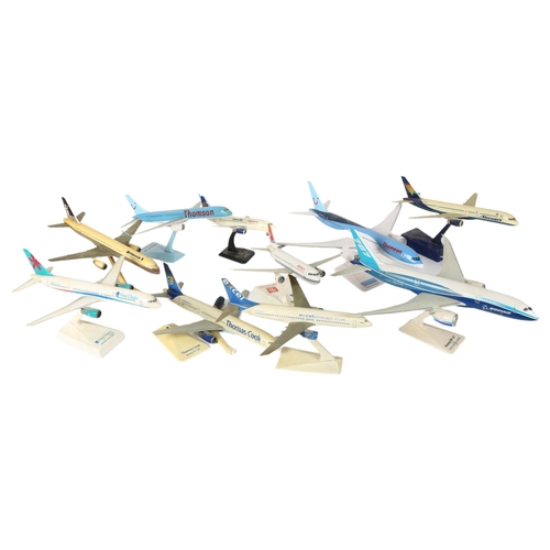 573 - A quantity of airplane passenger jet plastic models on display stands, including Boeing 787-8 Dreaml... 