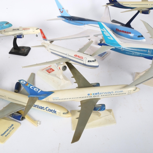 573 - A quantity of airplane passenger jet plastic models on display stands, including Boeing 787-8 Dreaml... 