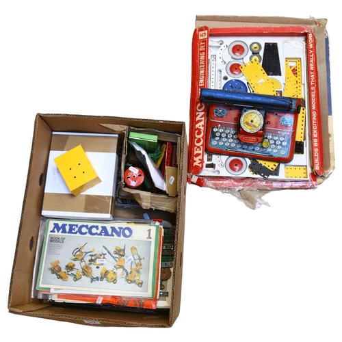 584 - A quantity of Meccano parts and instruction manuals, including instructions for no. 5A accessory out... 