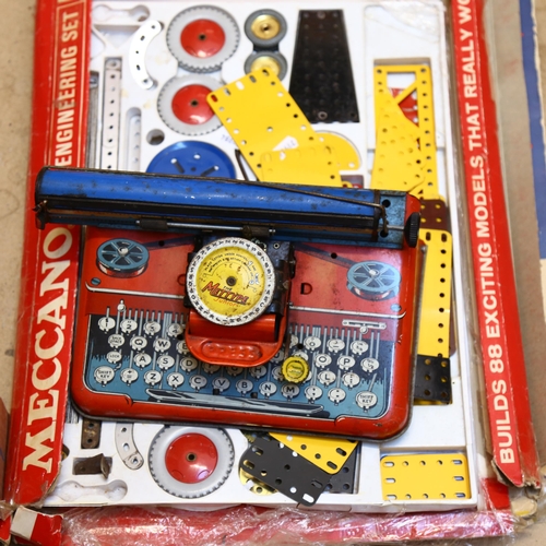 584 - A quantity of Meccano parts and instruction manuals, including instructions for no. 5A accessory out... 