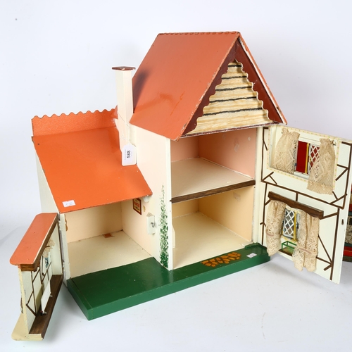 588 - A pair of Vintage wooden doll's houses, countryside cottages, largest H48cm, L42cm, D32cm