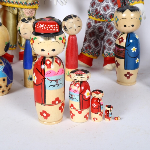 602 - A quantity of Kokeshi and various other Japanese style dolls, largest height 26cm