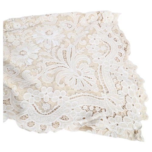 620 - A Brussels lace table cloth, 76cm x 42cm