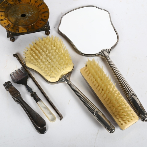 626 - A dressing table set, a mother-of-pearl handled fork, a lantern clock etc