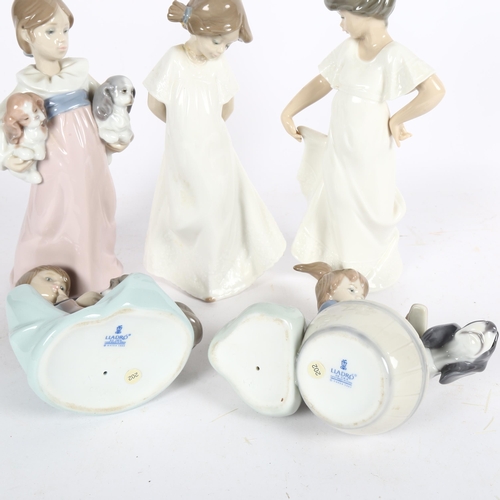 634 - 3 Lladro children with animals group, including a girl with 2 puppies, height 19cm, and 2 NAO girls