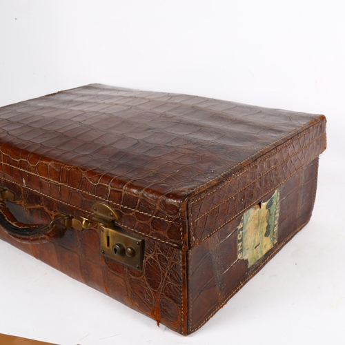 641 - A crocodile skin suitcase, length 50cm