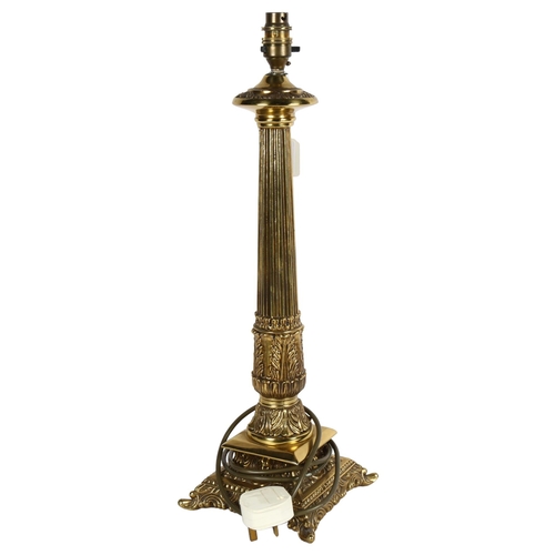 649 - A brass table lamp with acanthus leaf design, height 54cm