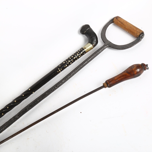 658 - A fire companion set with horse head finials, a walking stick, Mr Punch doorstop etc