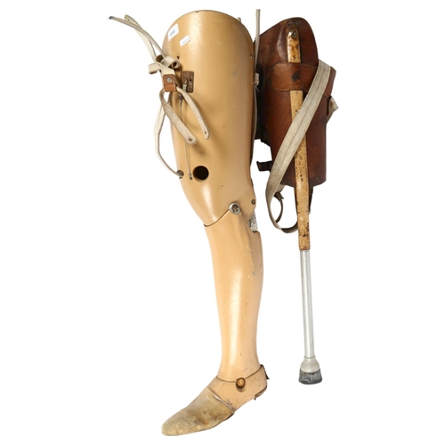 659 - An Antique leather-covered artificial leg, and a Protero artificial jointed leg and foot