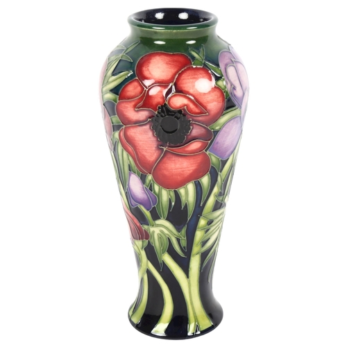 682 - A Moorcroft tube-lined baluster vase, with anemone design, 20cm