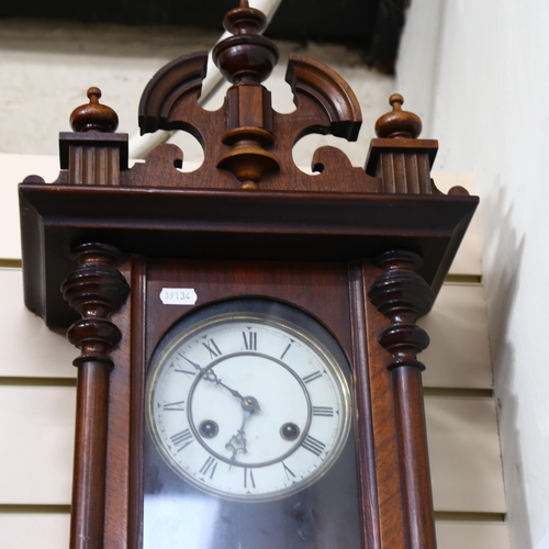 698 - A 2-train wall clock in ornate carved frame, height 66cm