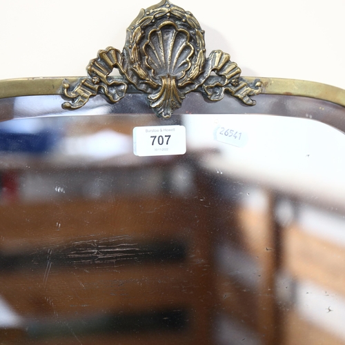 707 - An Antique brass-framed bevel-edge mirror with shell motif, 57cm across